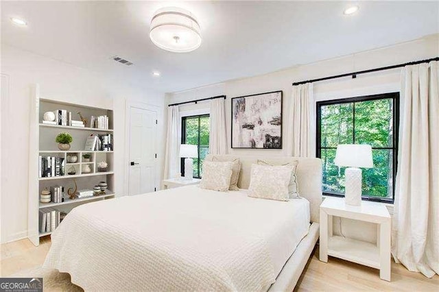 6090 River Chase Cir, Atlanta, GA 30328 - bedroom with wood finished floors and recessed lighting