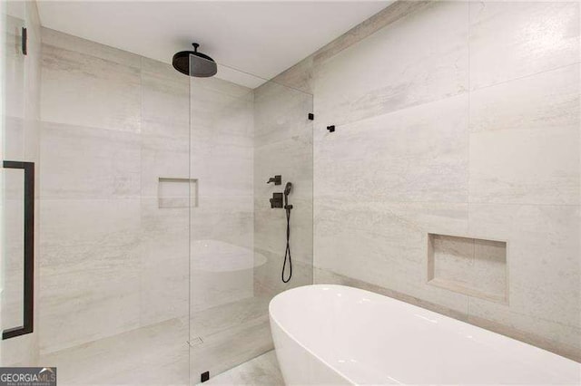 6090 River Chase Cir, Atlanta, GA 30328 - bathroom featuring a shower stall, a soaking tub, and tile walls