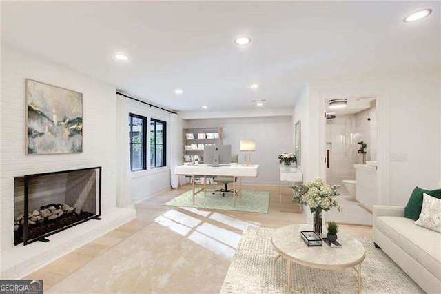 6090 River Chase Cir, Atlanta, GA 30328 - living area featuring an office area, recessed lighting, a fireplace with raised hearth, and wood finished floors