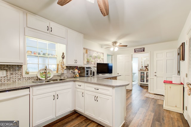 2440 Weatherford Ct, Marietta, GA 30068 - kitchen featuring ceiling fan, white dishwasher, a peninsula, and decorative backsplash