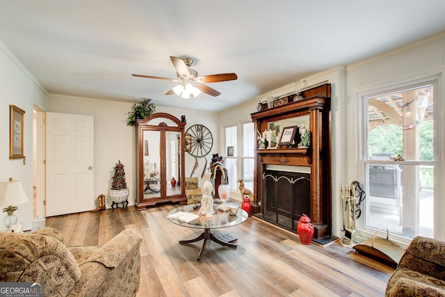 2440 Weatherford Ct, Marietta, GA 30068 - living room with a fireplace, wood finished floors, ceiling fan, and ornamental molding