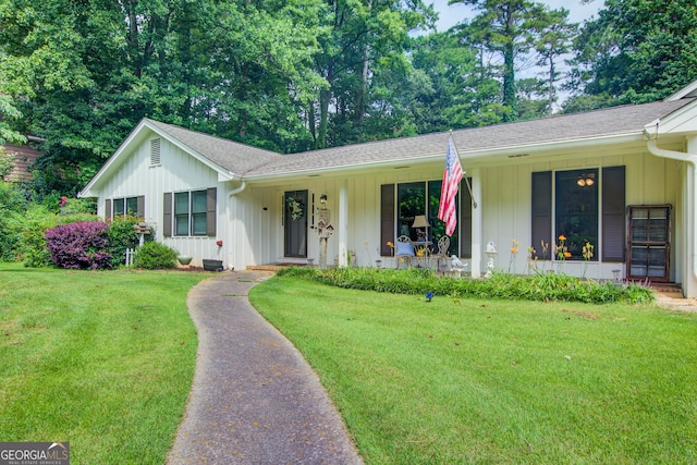 2440 Weatherford Ct, Marietta, GA 30068 - ranch-style home featuring board and batten siding, a front lawn, covered porch, and roof with shingles