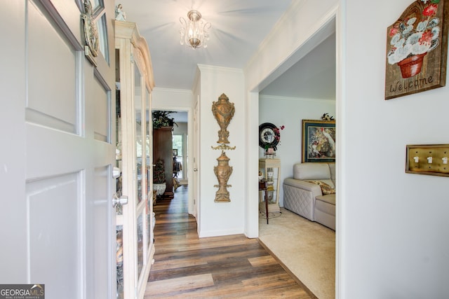 2440 Weatherford Ct, Marietta, GA 30068 - foyer featuring crown molding, dark wood-type flooring, and a chandelier