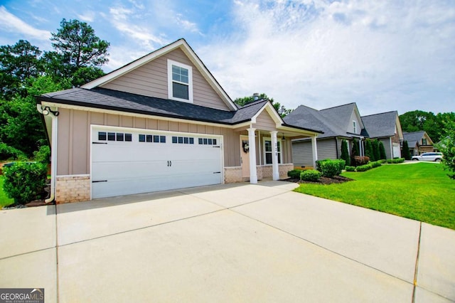 328 Brookstone Dr, Carrollton, GA 30116 - view of front of property featuring board and batten siding, roof with shingles, a front yard, concrete driveway, and a garage