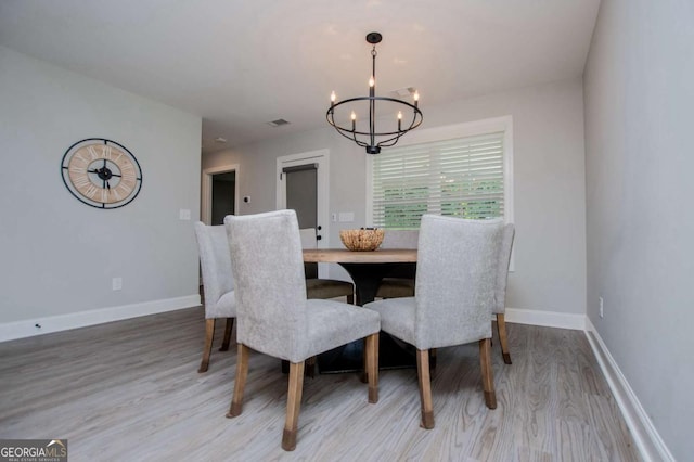 328 Brookstone Dr, Carrollton, GA 30116 - dining area featuring a chandelier and wood finished floors