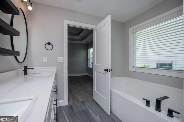 328 Brookstone Dr, Carrollton, GA 30116 - bathroom with double vanity and a bath