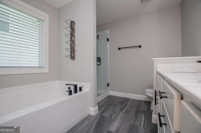 328 Brookstone Dr, Carrollton, GA 30116 - full bath with vanity, a bath, a stall shower, and wood finished floors