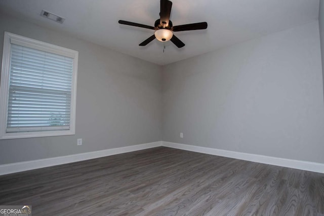 328 Brookstone Dr, Carrollton, GA 30116 - spare room with dark wood-type flooring and ceiling fan
