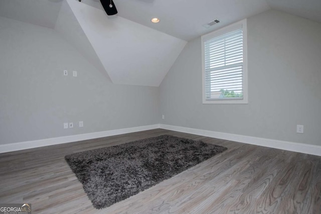 328 Brookstone Dr, Carrollton, GA 30116 - additional living space with vaulted ceiling, wood finished floors, ceiling fan, and recessed lighting
