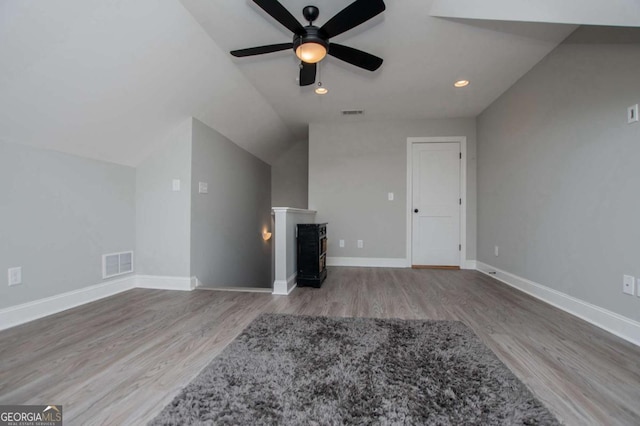 328 Brookstone Dr, Carrollton, GA 30116 - unfurnished living room featuring wood finished floors, a ceiling fan, lofted ceiling, recessed lighting, and a fireplace
