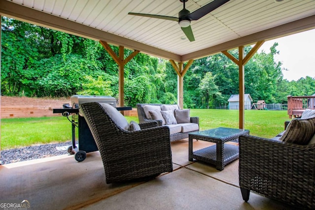 328 Brookstone Dr, Carrollton, GA 30116 - view of patio with outdoor lounge area, a ceiling fan, and view of wooded area