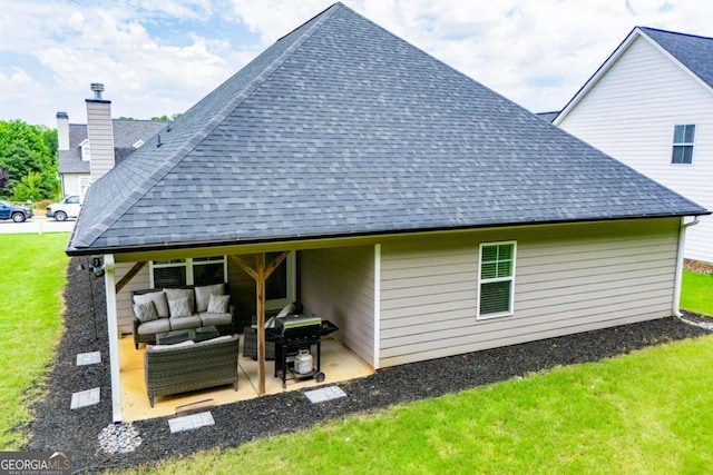328 Brookstone Dr, Carrollton, GA 30116 - rear view of property with outdoor lounge area, a shingled roof, a patio area, and a yard