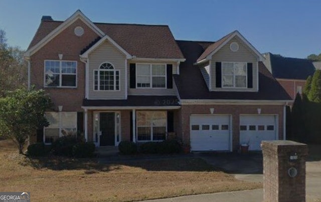 1090 Chapel Hill Dr SE, Lawrenceville, GA 30045 - traditional-style house with asphalt driveway and a garage