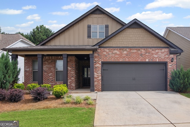 115 Court Xing, Locust Grove, GA 30248 - view of front of home featuring board and batten siding, brick siding, concrete driveway, and a garage