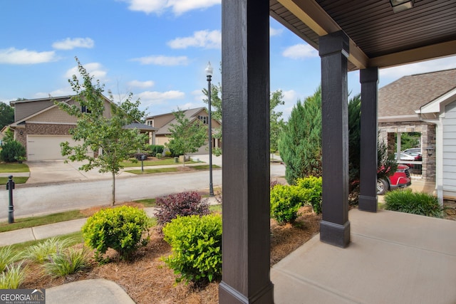 115 Court Xing, Locust Grove, GA 30248 - view of patio featuring driveway
