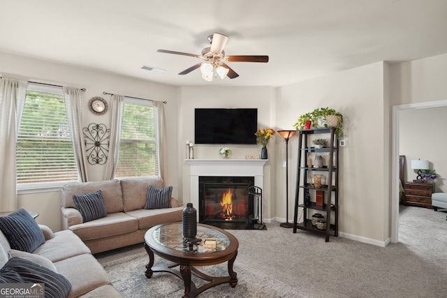 115 Court Xing, Locust Grove, GA 30248 - living area with a fireplace with flush hearth, carpet floors, and a ceiling fan