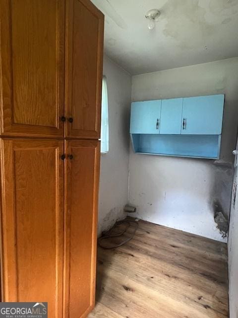 1041 Sandy Ridge Rd, Mcdonough, GA 30252 - laundry area featuring light wood finished floors