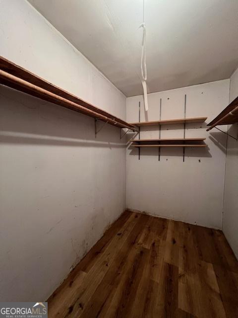 1041 Sandy Ridge Rd, Mcdonough, GA 30252 - spacious closet with wood finished floors