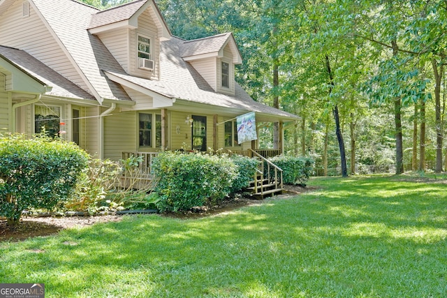292 Selfridge Rd, Mcdonough, GA 30252 - view of side of home featuring a lawn, a shingled roof, and a porch