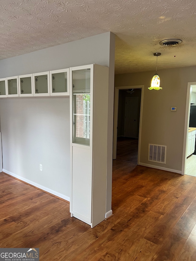 470 Huntington Rd Unit 5, Athens, GA 30606 - spare room featuring dark wood-type flooring and a textured ceiling