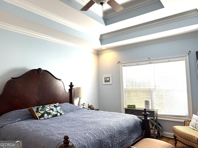 327 Highland Pointe Dr, Cohutta, GA 30710 - bedroom featuring multiple windows, crown molding, wood finished floors, a raised ceiling, and ceiling fan