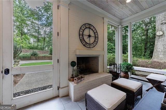 510 Heards Ferry Rd, Atlanta, GA 30328 - sunroom featuring a fireplace with raised hearth and plenty of natural light