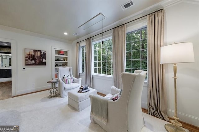 510 Heards Ferry Rd, Atlanta, GA 30328 - sitting room featuring built in shelves, recessed lighting, and wood finished floors