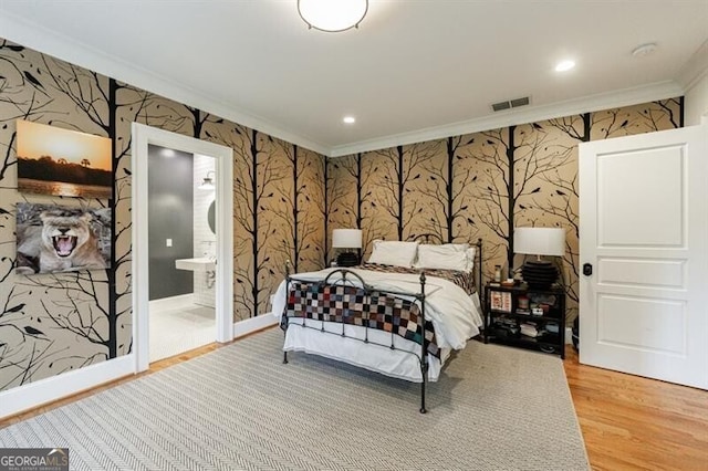 510 Heards Ferry Rd, Atlanta, GA 30328 - bedroom with wallpapered walls, ornamental molding, light wood-style flooring, recessed lighting, and connected bathroom