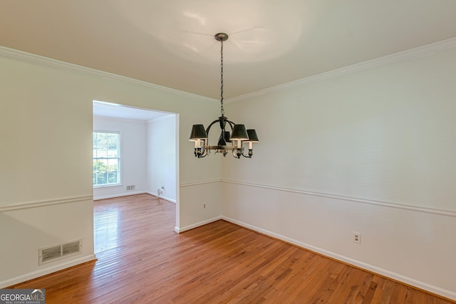 3109 Albatross Ln, Decatur, GA 30034 - spare room featuring a chandelier, light wood-style flooring, and ornamental molding