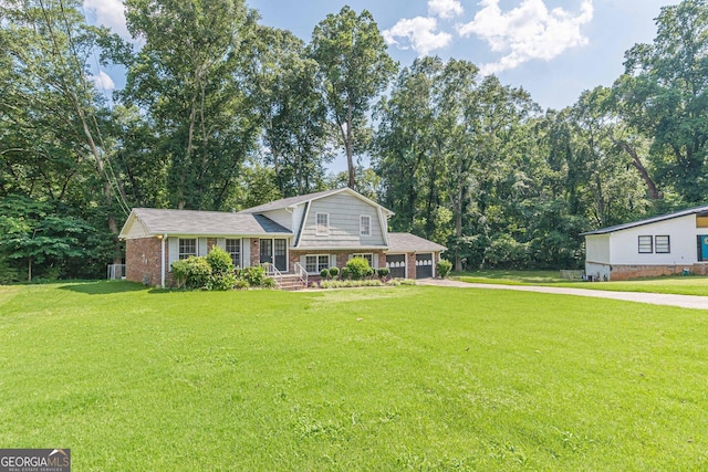 3109 Albatross Ln, Decatur, GA 30034 - tri-level home featuring driveway, a garage, a front lawn, brick siding, and a porch