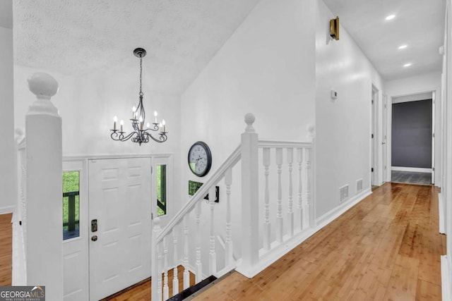 3860 Paint Cir, Douglasville, GA 30135 - entrance foyer featuring light wood-style floors, a chandelier, and recessed lighting