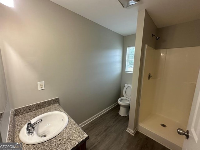 1017 Wheel House Ln Unit D, Monroe, GA 30655 - bathroom with wood finished floors, vanity, and a shower