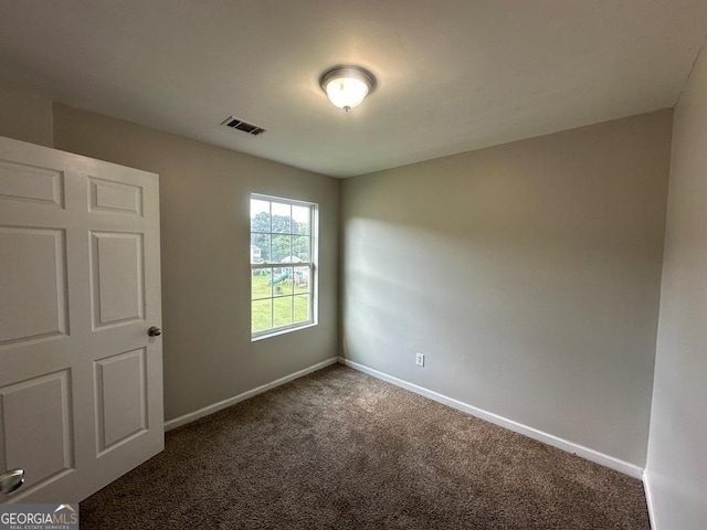 1017 Wheel House Ln Unit D, Monroe, GA 30655 - spare room featuring carpet and baseboards