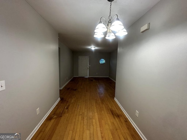 1017 Wheel House Ln Unit D, Monroe, GA 30655 - hall with a chandelier and wood-type flooring