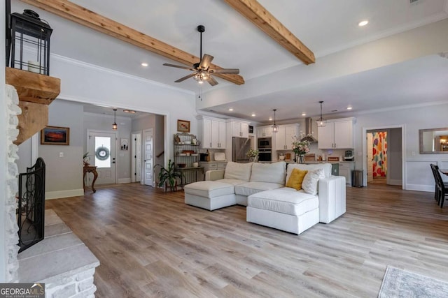 1111 Mcleods Estates Dr, Monroe, GA 30655 - living room featuring a ceiling fan, light wood-style floors, beam ceiling, crown molding, and recessed lighting