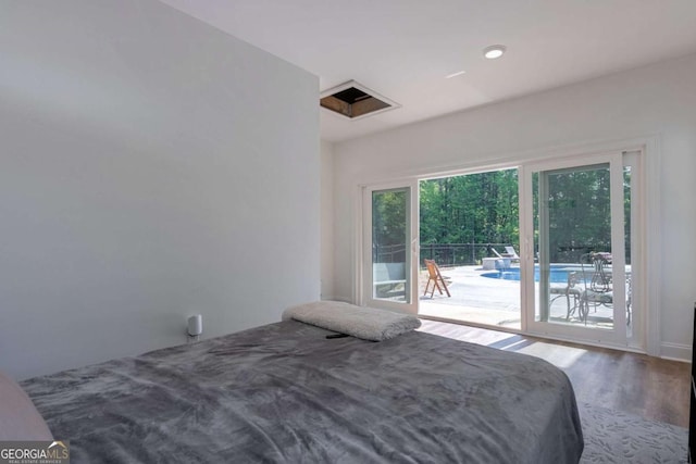 1111 Mcleods Estates Dr, Monroe, GA 30655 - bedroom with access to exterior and wood finished floors