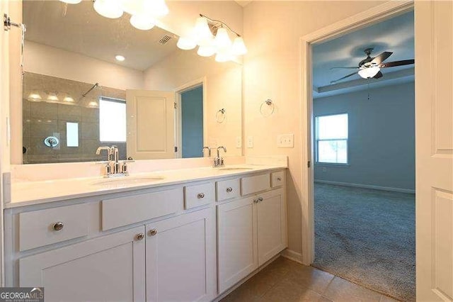 1057 Towne Mill Xing, Canton, GA 30114 - full bath with double vanity, tile patterned floors, a tile shower, and a ceiling fan