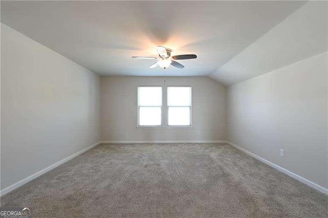 1057 Towne Mill Xing, Canton, GA 30114 - carpeted spare room with a ceiling fan and vaulted ceiling