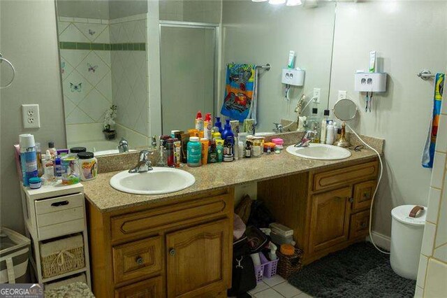 5590 Stonewood Ct, Norcross, GA 30093 - bathroom featuring double vanity and tile patterned flooring