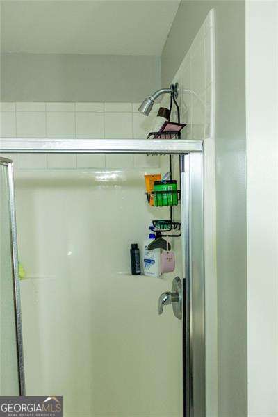 5590 Stonewood Ct, Norcross, GA 30093 - bathroom with a shower with door