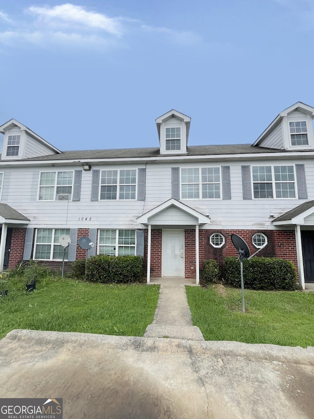 1042 Wheel House Ln Unit C, Monroe, GA 30655 - townhome / multi-family property featuring a front yard and brick siding
