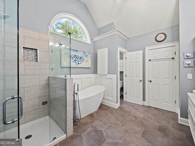 302 Thornhill Cir, Jefferson, GA 30549 - full bath with a stall shower, a freestanding bath, lofted ceiling, vanity, and wainscoting