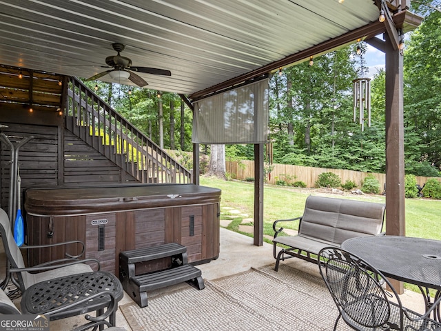 302 Thornhill Cir, Jefferson, GA 30549 - fenced backyard featuring a hot tub, a ceiling fan, a patio area, and stairs