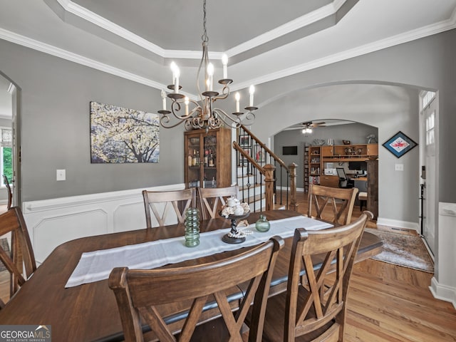 302 Thornhill Cir, Jefferson, GA 30549 - dining area featuring arched walkways, stairs, a ceiling fan, wood finished floors, and crown molding