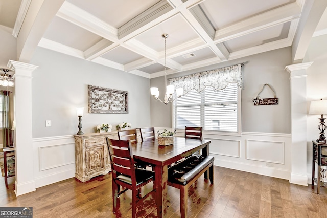 2325 Lake Cove Ct, Buford, GA 30519 - dining area with decorative columns, a chandelier, wood finished floors, beamed ceiling, and a wainscoted wall