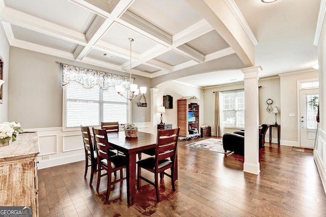 2325 Lake Cove Ct, Buford, GA 30519 - dining space with decorative columns, arched walkways, plenty of natural light, dark wood-style flooring, and beamed ceiling