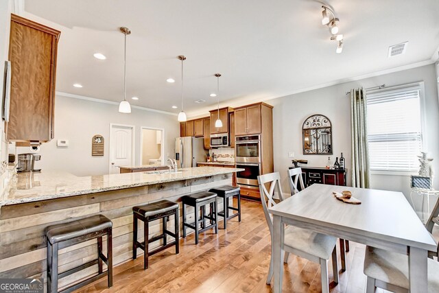 2325 Lake Cove Ct, Buford, GA 30519 - dining room featuring crown molding, light wood finished floors, and recessed lighting