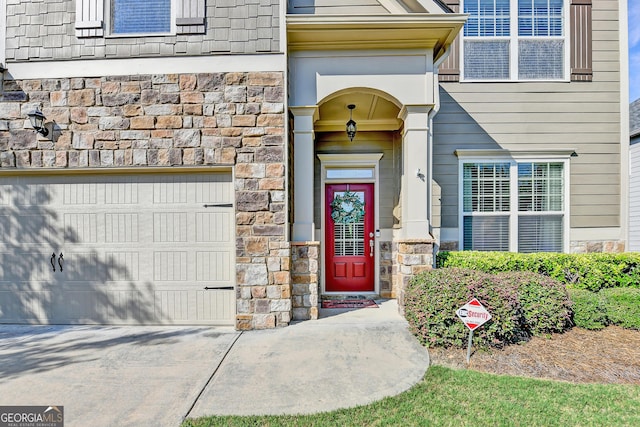 2325 Lake Cove Ct, Buford, GA 30519 - doorway to property featuring stone siding and driveway