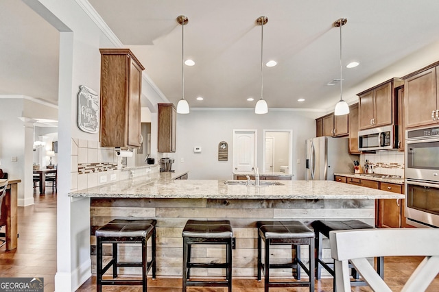 2325 Lake Cove Ct, Buford, GA 30519 - kitchen featuring stainless steel appliances, ornamental molding, tasteful backsplash, recessed lighting, and a peninsula