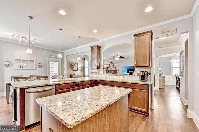 2325 Lake Cove Ct, Buford, GA 30519 - kitchen with dishwasher, a peninsula, a ceiling fan, a center island, and wood finished floors